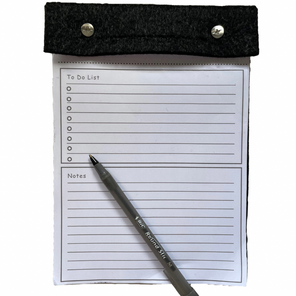 A5 charcoal felt wrap covered notepad for the desk with pen showing size