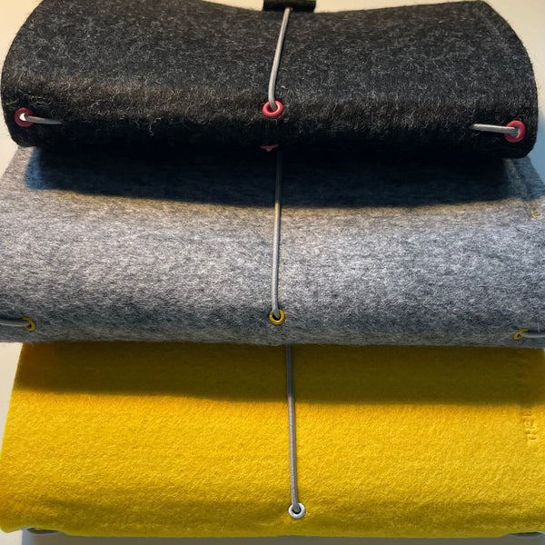 A5 felt wrap charcoal grey, silver grey and bright yellow Stacked to show colours