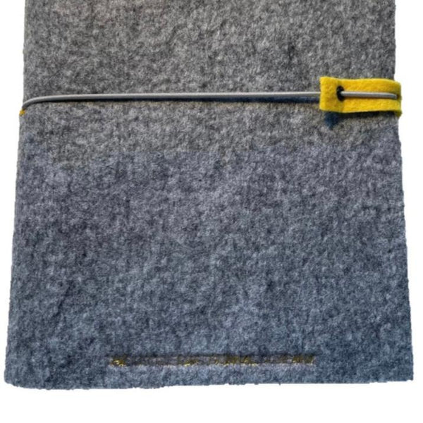 A5 silver grey felt wrap close up to see embossed logo and elastic strap