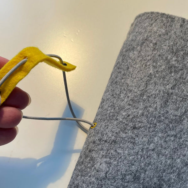 A5 silver grey felt wrap with elastic strap to hold contents secure