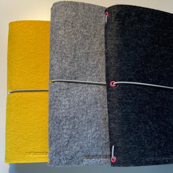 A selection of A5 felt journal wraps showing different colours