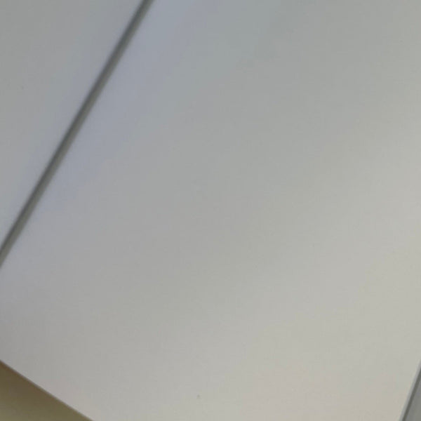 Blank pages insert close up showing elastic strap holding it in.