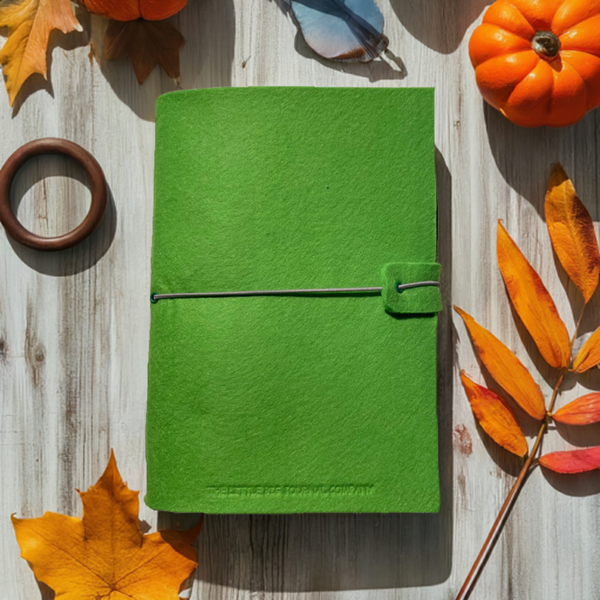 Bright green A5 felt journal wrap on autumn table