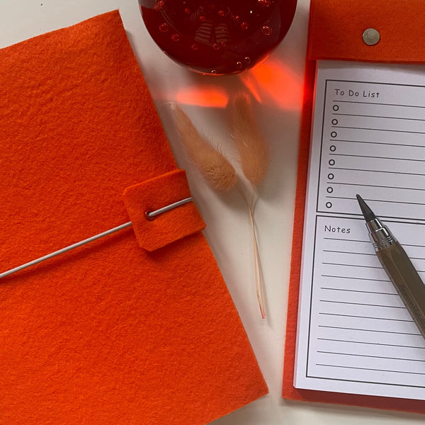 Bright orange A5 felt wrap notebook with matching desk notepad with tear off pages