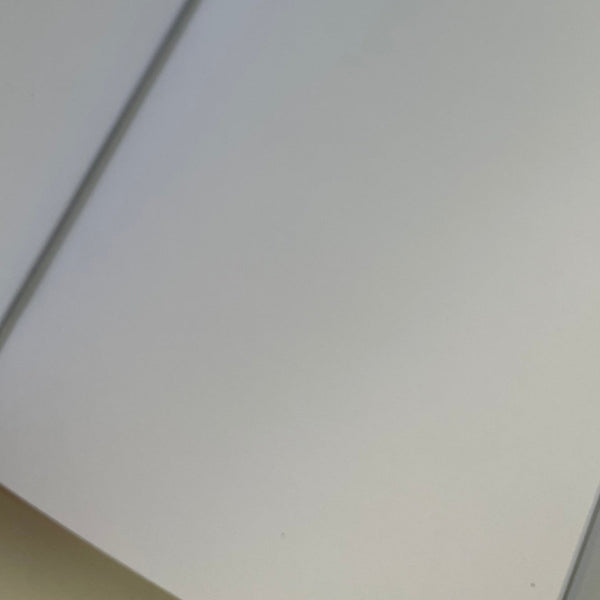 Picture showing one of the notebooks being held in with an elastic strap