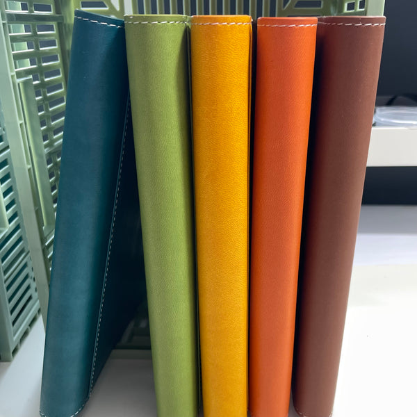 Autumn colours faux leather refillable journals showing all the colours the journals are available in.