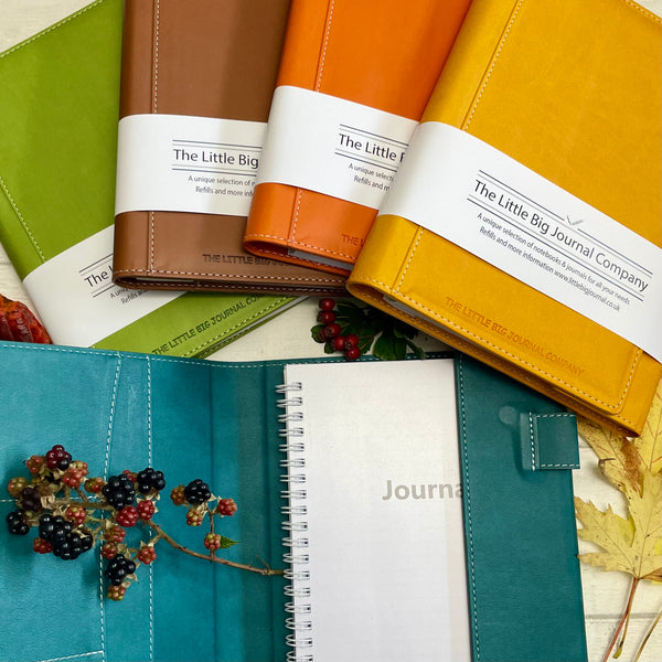 Autumn colours faux leather refillable journal a group picture showing all the colours the journals are available in, highlighting the autumn colours